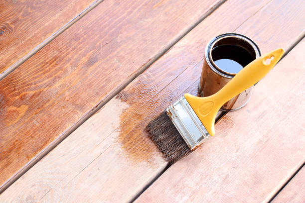 Paint brush and paint can and for a timber deck